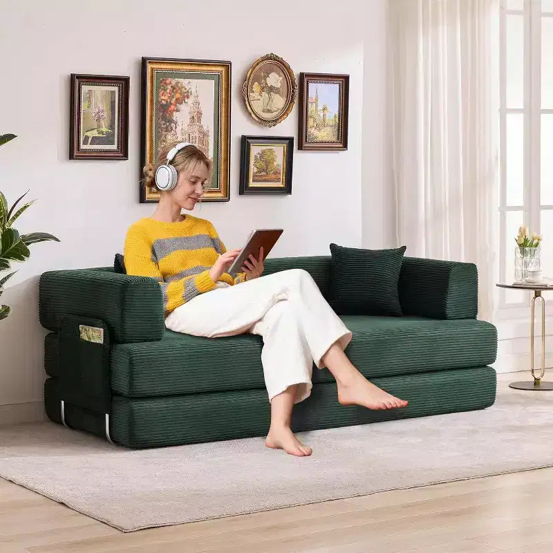Canapé-lit de sol en velours côtelé avec coussins, accoudoirs et dossier convertibles, adapté aux salons, chambres et appartements.